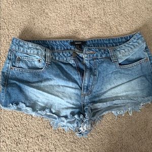 Very short frayed denim shorts
